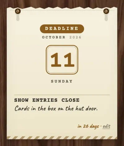 A notice on manila stock with hazard stripes along its foot, headed DEADLINE, October 2026. The numeral 11 sits in a rounded box over Sunday, with no time given, and the line SHOW ENTRIES CLOSE, cards in the box on the hut door. The foot reads in 26 days.